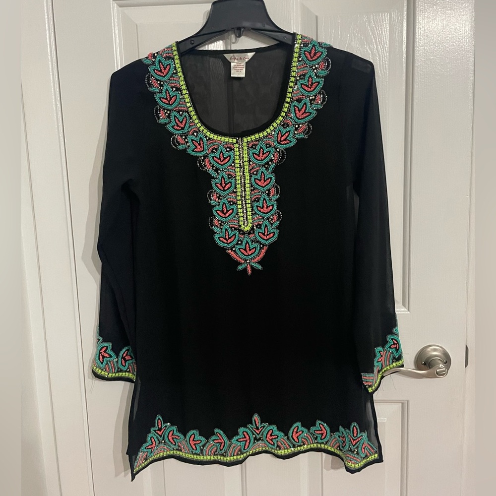 Gorgeous swim suit cover-up. Look stylish heading to the pool!